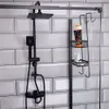 A black shower shelf unit with toiletries is shown against a tiled wall. Náhled obrázku produktu