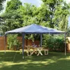 A party tent set up in a backyard with a picnic table and benches. Náhled obrázku produktu