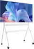 A white rolling TV stand with a large TV mounted on it, displaying a colorful abstract image. Anteprima dell’immagine prodotto