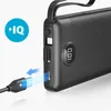 A close-up shot of a black power bank with a charging cable being inserted. Anteprima dell’immagine prodotto