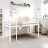 A white wooden loft bed with a mattress and bedding in a child's bedroom. There are shelves on the wall with decorative items and a rug on the floor. Produktbild-Vorschau