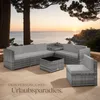 A rattan lounge set is arranged on a patio overlooking the ocean at sunset. Náhled obrázku produktu