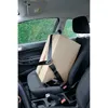A cardboard box secured with a seatbelt in the passenger seat of a car. Anteprima dell’immagine prodotto