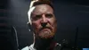 A close-up of a man's face, holding a knife. Produktbild-Vorschau