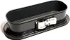 A dark gray oval-shaped cake pan with a silver latch is shown on a white background. Anteprima dell’immagine prodotto