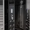 A close-up view of a modern black shower cabin with various features. Anteprima dell’immagine prodotto