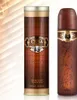 Two perfume bottles, one in a cylindrical tin, are displayed against a light, striped background. Náhled obrázku produktu