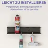 A black metal wall-mounted organizer holding a can of spray foam and two power tools. Produktbild-Vorschau