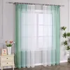 A window with sheer curtains, a nightstand with decorative items, and a plant. Produktbild-Vorschau