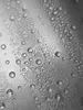 A close-up view of water droplets on a surface. Produktbild-Vorschau