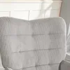 A close-up view of the backrest of a gray corduroy armchair. Anteprima dell’immagine prodotto