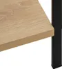 A close-up view of a wooden shelf and a black metal support leg of a bookshelf. Produktbild-Vorschau