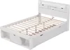 A white wooden bed frame with a slatted base, a headboard with storage compartments, and drawers underneath. Podgląd zdjęcia produktu