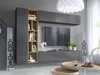 A modern living room setup featuring a wall-mounted entertainment unit with a TV, shelving, and speakers. Produktbild-Vorschau