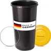 A black trash can with a yellow lid and a "Made in Germany" label. Produktbild-Vorschau