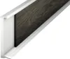 A close-up, angled view of a white PVC skirting board with a dark wood-effect insert, set against a white background. Produktbild-Vorschau