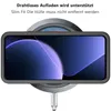 A smartphone in a protective case is shown wirelessly charging on a charging pad. Produktbild-Vorschau