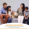 A family with a dog sitting on a couch. Produktbild-Vorschau