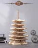 A detailed wooden model of a five-story pagoda is displayed against a light gray background. Decorative gears are visible in the background. Voir les images du produit