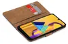 A brown book-style phone case with two cards inserted, open to reveal a smartphone with a colorful wallpaper. Produktbild-Vorschau