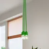 A close-up of a green pendant light fixture with multiple bulbs hanging from the ceiling. Produktbild-Vorschau