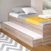 A bed with a pull-out trundle, showing bedding. Podgląd zdjęcia produktu