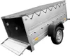 A silver trailer with a gray tarp cover and an open rear ramp, shown on a white background. Náhled obrázku produktu