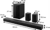 A diagram showing the dimensions of a soundbar system, including a soundbar, subwoofer, and two satellite speakers. Voir les images du produit