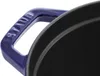 A close-up view of a blue Staub cast iron pot handle and rim. Náhled obrázku produktu