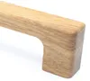 Close-up of a wooden cabinet handle against a white background. Produktbild-Vorschau