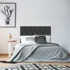A bedroom scene with a bed, side table, and artwork. Náhled obrázku produktu
