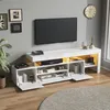 A modern living room with a TV stand, TV, and decorative items. Anteprima dell’immagine prodotto