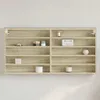 A wall-mounted shelf unit with various decorative items. Podgląd zdjęcia produktu