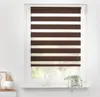 A close-up view of a brown and white striped roller blind covering a window. Produktbild-Vorschau