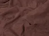 A close-up, draped view of dark brown terry cloth fabric. Produktbild-Vorschau