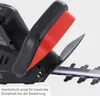 A close-up view of the handle and blade of an electric hedge trimmer. Náhled obrázku produktu