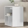 A white side table with books on one shelf and a cup and plant on top. Produktbild-Vorschau