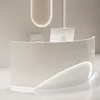 A modern, minimalist reception desk in a bright, clean environment. Produktbild-Vorschau