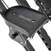 A close-up view of a black pedal on a piece of exercise equipment. Podgląd zdjęcia produktu