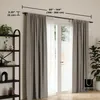 A curtain rod with gray curtains and sheer white curtains hanging in front of a glass door, with a bookshelf and a plant in the foreground. Podgląd zdjęcia produktu