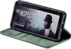 A green flip case for a Huawei P20 Lite phone, displaying a movie poster on the phone screen. Produktbild-Vorschau
