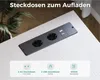 A dark gray power strip with two AC outlets and two USB ports is embedded in a light-colored wooden desk. Below the power strip, there are icons and text describing its features. Podgląd zdjęcia produktu