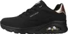 A side view of a black Skechers sneaker with rose gold accents. Voir les images du produit