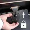 A hand is shown adjusting a black wooden lock mechanism on a black wooden surface, with an arrow and lock icon indicating a locking function. Produktbild-Vorschau
