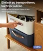 A hand is shown reaching for a white storage box stacked on top of a dark blue storage box, both with brown handles, on a wooden shelf. Produktbild-Vorschau