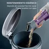 A hand is emptying dust from a vacuum cleaner's dustbin into a larger container. Náhled obrázku produktu