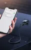 A hand holding a smartphone is shown connected to a car charger via a coiled USB cable. Podgląd zdjęcia produktu