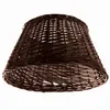 A brown wicker basket shaped like a lampshade or tree skirt, isolated on a white background. Produktbild-Vorschau