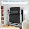A foldable lounge chair is shown in a room next to a bookshelf and a lamp. Produktbild-Vorschau