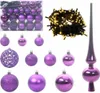 A collection of purple Christmas ornaments and string lights. Produktbild-Vorschau